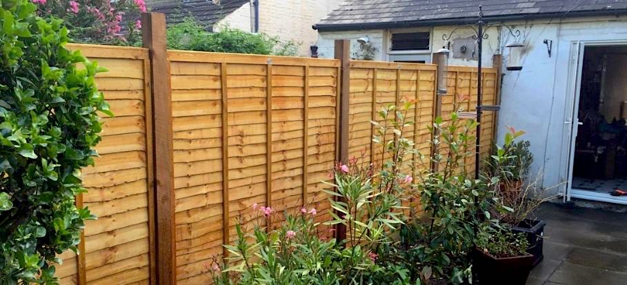 Garden fence built in Larchlap fencing design